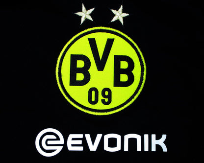 Schwarzes Borussia Dortmund BVB Trainingstrikot Puma 2018/19 in der Langarmversion. Als reduziertes Angebot günstig kaufen. Vereinswappen.