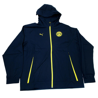 Offizielle Puma Borussia Dortmund Woven Trainingsjacke der Saison 2025/26 für Herren in Schwarz-Gelb mit aufgummiertem BVB-Vereinswappen und windCELL-Technologie – Neu mit Etikett. Ansicht Flach.